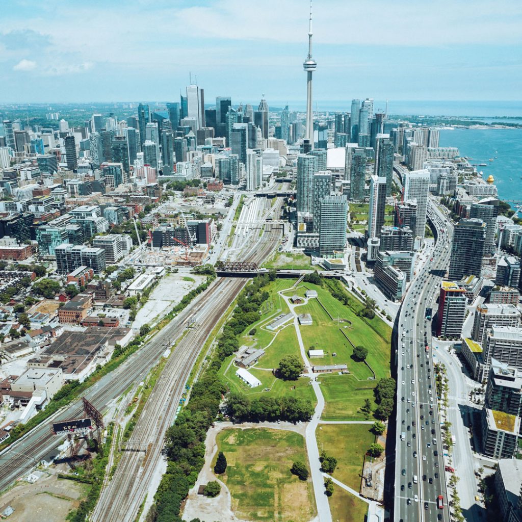 Tall Toronto buildings in the distance, including the CN Tower