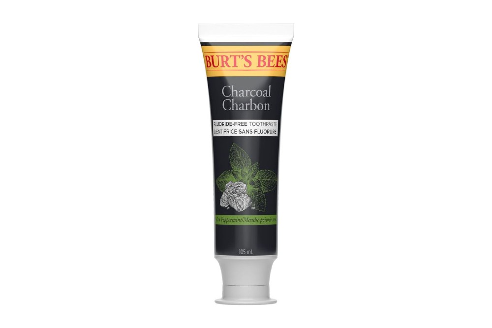 tube of charcoal burt's bees toothpaste on white background